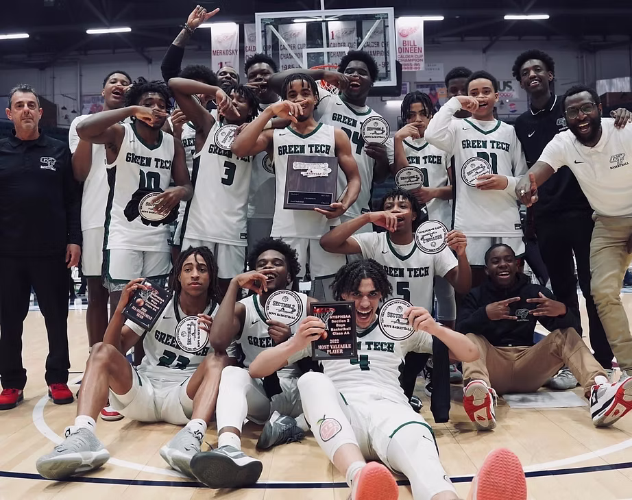 Green Tech Charter School Eagles basketball team celebrating the 2021 Section II championship