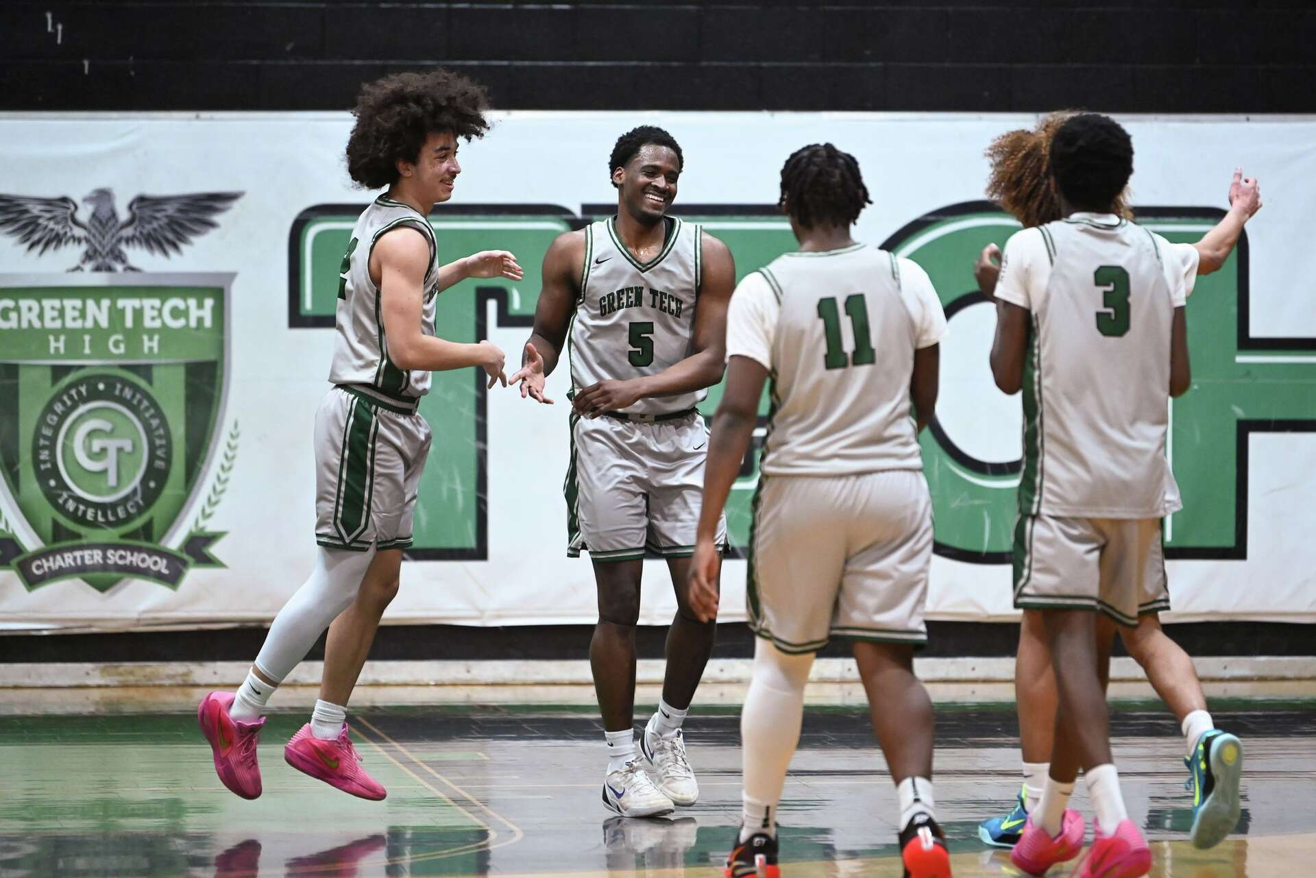 Green Tech athletes on the field and court